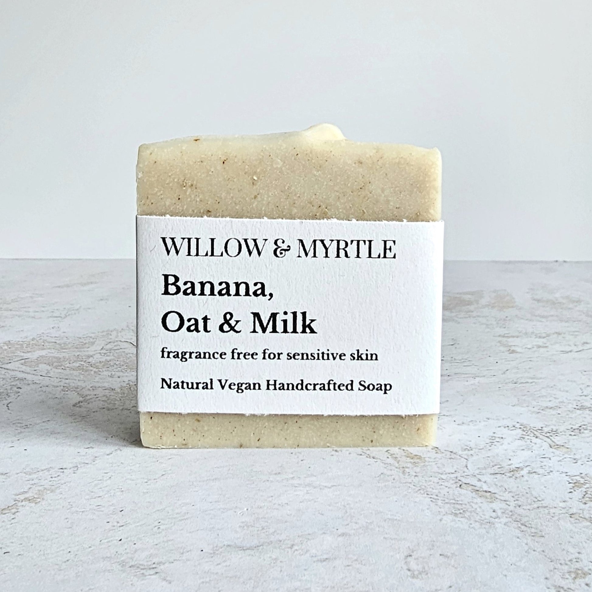 Banana oat coconut milk shampoo with simplistic label. cream beige squar shaped soap