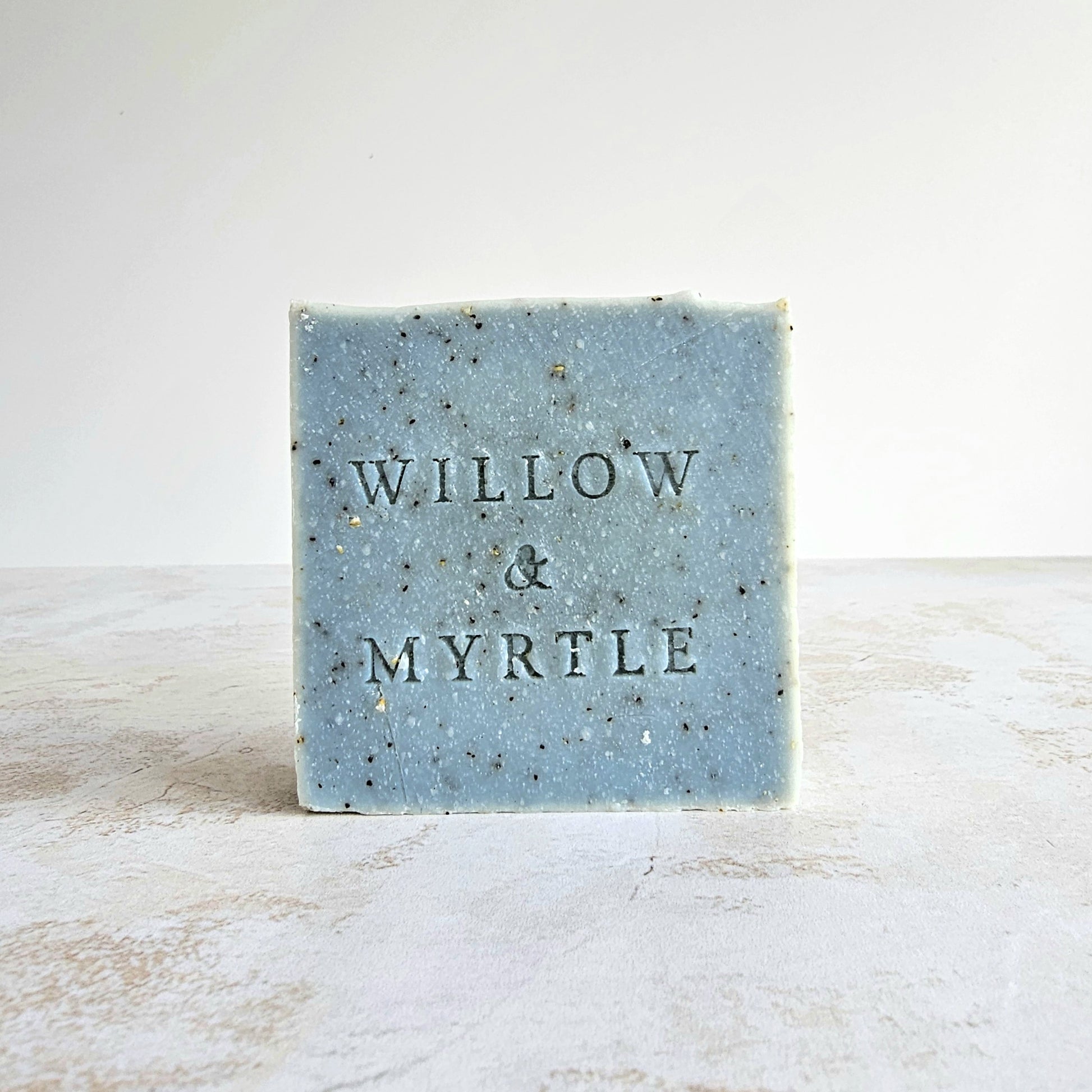 Gardeners soap, exfoliating soap bar with coffee and oatmeal. blue colour, square shape, stamped soap