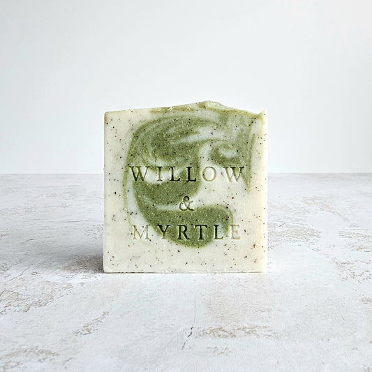 Exfoliating soap bar with ground apricot stone, green swirl soap coloured naturally with green clay and chlorella