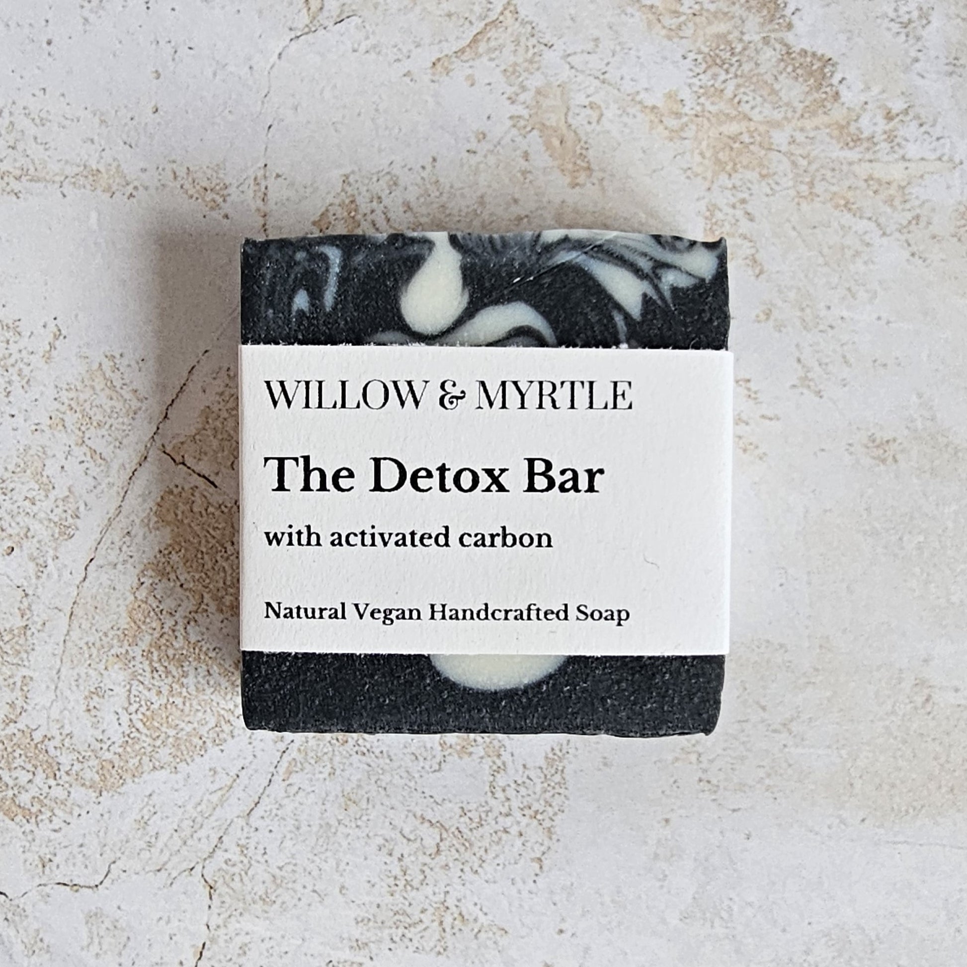 black square soap bar with white simple label