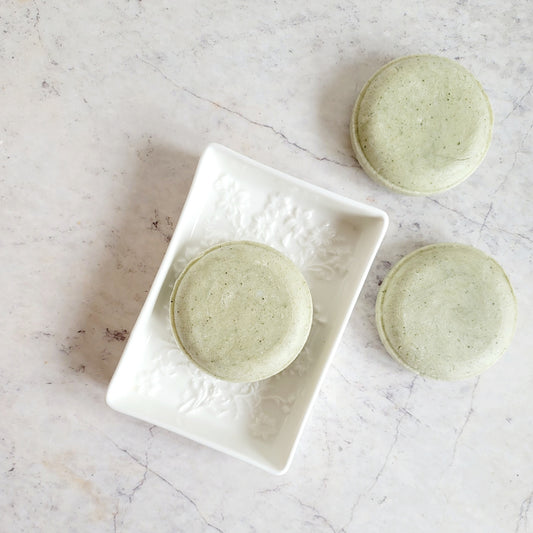rosemary mint solid shampoo bar, round green disk