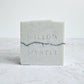 pale blue soap bar with black charcoal pencil line in centre