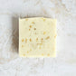 pale yellow square soap with our logo stamped in front