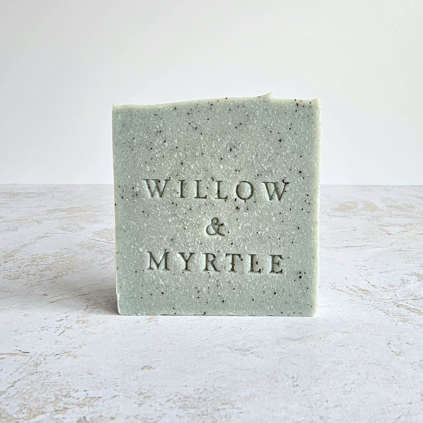 pale blue soap with specs of ground apricot stone.